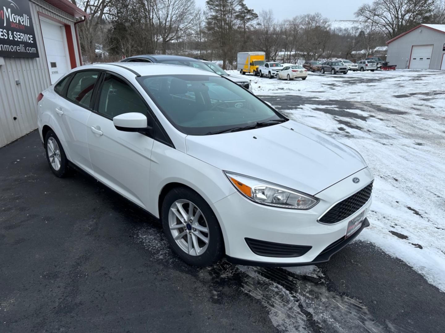 2018 White Ford Focus SE Sedan (1FADP3F20JL) with an 2.0L L4 DOHC 16V engine, Auto transmission, located at 8464 Route 219, Brockway, PA, 15824, (814) 265-1330, 41.226871, -78.780518 - Clean, well taken care of Ford Focus Se Sedan with 4 cylinder engine, air condition, power windows and locks, factory alloys and only 71000 miles. This pre owned car has been serviced, Pa-Inspected, and comes with warranty. Stop in or call one of the Morelli boys today to see this car which is pric - Photo#12